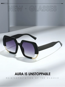 Detail of oversized black sunglasses with gradient purple lenses and gold metal accents