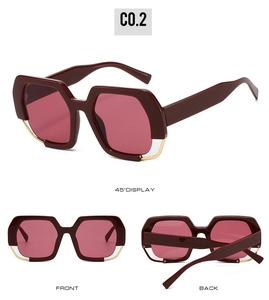 Detail view of burgundy polygon sunglasses featuring thick frames and gold metal accents