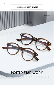 Macro view of vintage TR oval frame glasses with metal rivets and size info on temple