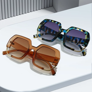 Modern polygonal oversized sunglasses with tortoiseshell patterns and gold metal rim accents