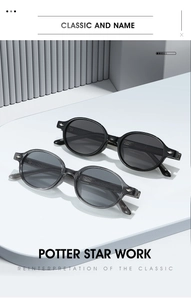 Close-up of retro round TR90 sunglasses with silver diamond rivets on white display pedestals