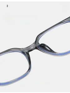 Detail view of the gray translucent TR90 frame with integrated nose pads and blue accents