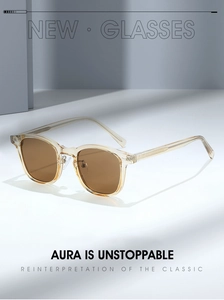 Detail of trendy TR90 sunglasses featuring champagne frames and dark brown lenses