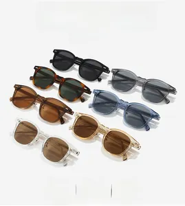 Detail shot of multiple colorful TR90 square sunglasses with metal dot accents