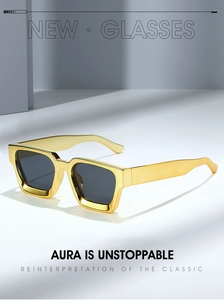 Detail of square gold metal sunglasses with thick temples and dark lenses