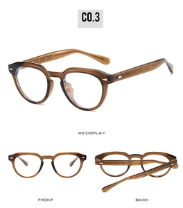 Detail view of round amber TR90 eyeglass frame with silver rivet decor and 45-degree angle