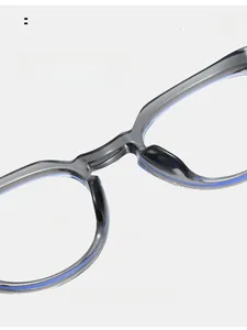 Macro detail of comfortable integrated nose pads on TR90 grey translucent round eyeglass frames