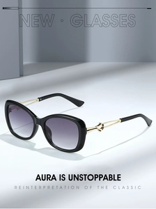 Detail view of butterfly sunglasses with gradient purple lenses and gold metal temples