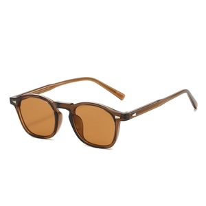 Vintage amber round frame TR90 sunglasses with metal rivets shown at a 45-degree angle