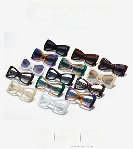 Detail view of colorful cat-eye eyewear frames showing multiple assorted fashion colors