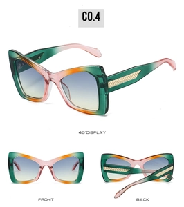 Detail view of butterfly frame sunglasses with tricolor gradient and golden temples