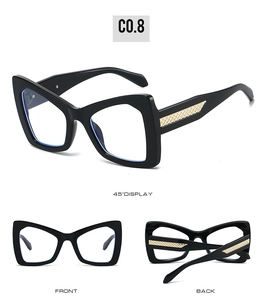 Three perspectives of black cat-eye sunglasses with golden quilted pattern temples