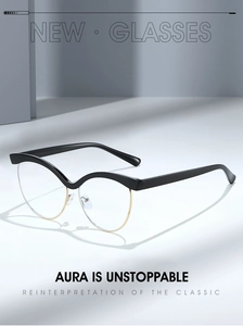 Detail of cat eye half-frame glasses with black wavy top and gold metal bottom rims