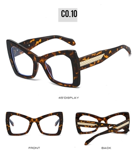 Detailed view of oversized butterfly tortoise shell sunglasses with gold mesh temple accents