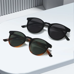 Retro TR90 round frame sunglasses in black and tortoiseshell with UV protection lenses