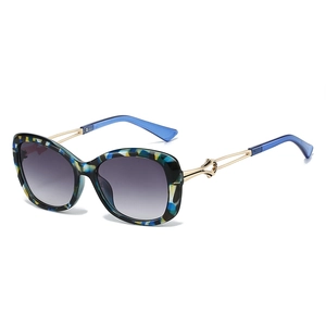 Fashion oversized sunglasses with colorful pattern frame and gold knot detail temples
