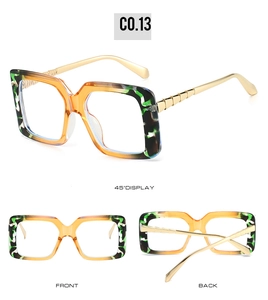 Detailed views of square frame sunglasses with orange trim and gold metal hinges