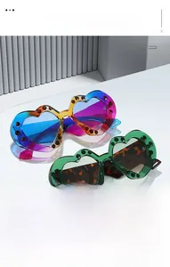Detail of rhinestone heart sunglasses with gradient frames and sparkling crystal decor