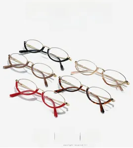 Detail view of five trendy half-rim metal glasses in black, brown, red, and tortoise colors