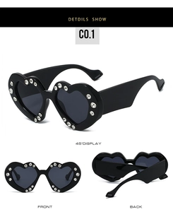 Detailed views of heart-shaped sunglasses featuring sparkling rhinestone edges and wide temples