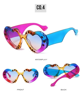 Detailed views of heart-shaped sunglasses with rhinestones in multiple perspectives