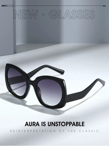 Detailed macro view of black butterfly frame with purple gradient lenses and metal hinges