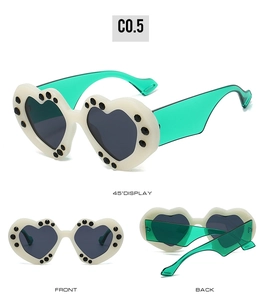 Detailed multi-angle views of heart-shaped sunglasses with white frame and green temples