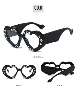 Detailed views of heart-shaped sunglasses with rhinestones showing front and side angles