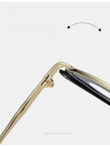 Close-up of a durable golden metal hinge on minimalist vintage blue light glasses