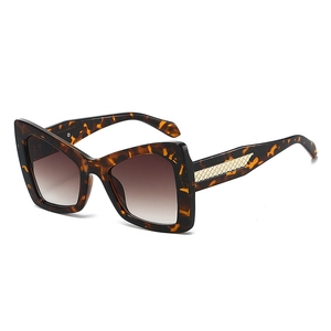 Fashionable oversized tortoise shell sunglasses with gradient brown lenses and gold temples