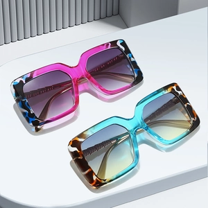 Fashionable oversized square sunglasses with gradient lenses and vibrant tiger stripe frames