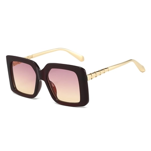 Fashionable oversized square sunglasses with gradient purple lenses and gold metal temples