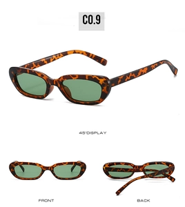 Vue détaillée des lunettes de soleil ovales rétro avec monture écaille et verres verts