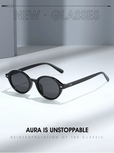 Detail view of black round vintage sunglasses with textured non-slip temples on sleek pedestal