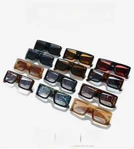 Flat lay of square fashion sunglasses in multiple frame colors and gradient lenses