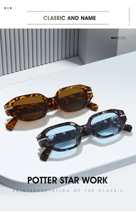 Detail of vintage oval sunglasses in tortoise and marble frames with metal accents