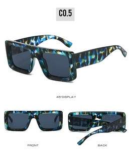 Detail view of square sunglasses with blue and yellow tortoiseshell frame and dark lenses