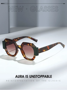 Detailed side view of hexagonal tortoise shell sunglasses with dark green temple accents