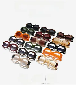 Flat lay of diverse chunky frame sunglasses in multiple vibrant colors and patterns