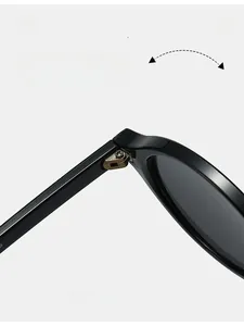 Macro shot of durable metal hinges and size specs 48-21-143 on black eyewear frames