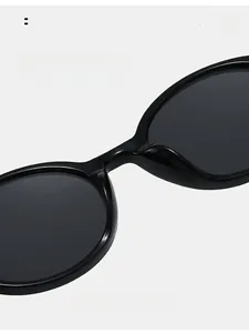 Close-up of comfortable integrated nose pads on classic black round frame sunglasses