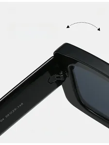 Macro detail of a durable texture hinge and white size specs on black square sunglasses