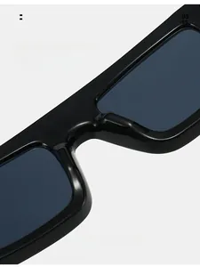 Detail of square black sunglasses showing smooth integrated nose pads for comfortable wear