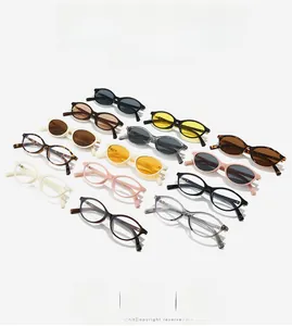 Flat lay of oval and rectangular sunglasses in various frame colors and tinted lenses