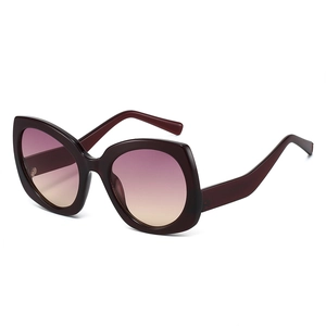 Burgundy butterfly frame sunglasses with pink-yellow gradient lenses in a 45-degree view