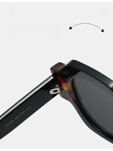 Detail of durable metal hinge on thick black frame sunglasses with tortoiseshell accent