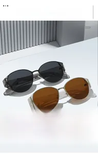 Close-up of retro cat-eye sunglasses with metal frames and protective side shields