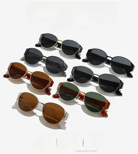 Flat lay of seven stylish cat-eye sunglasses in various colors and trendy frame designs