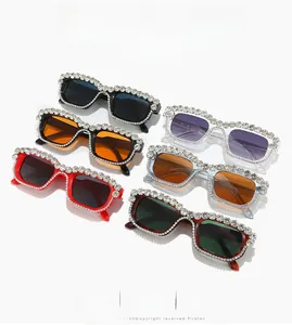 Detailed flat lay of square rhinestone-encrusted sunglasses in six assorted vibrant colors