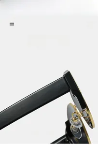 Detailed view of black and gold sunglasses hinge with light super elastic material